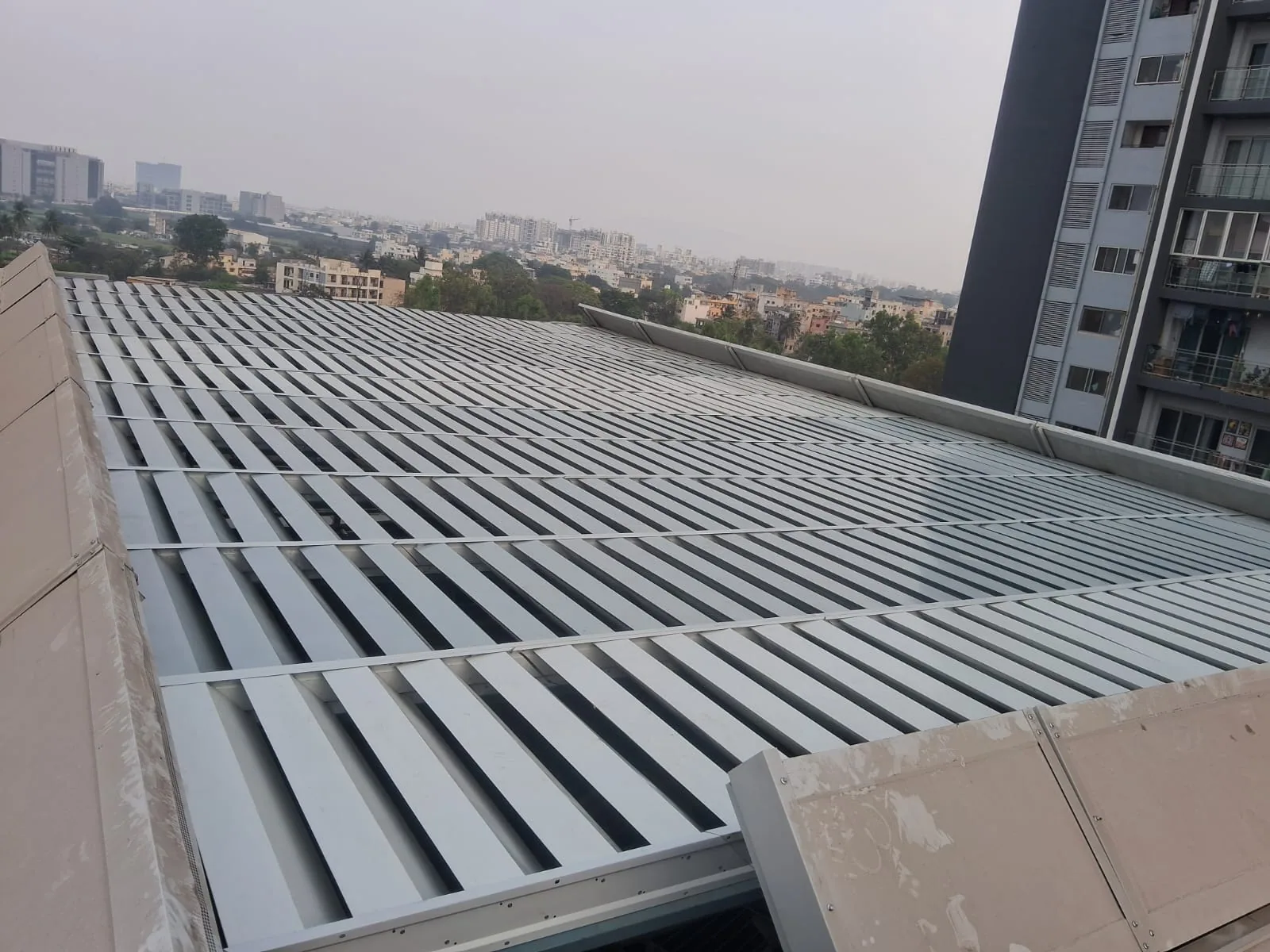 Acoustic louver modules across the top opening of the Amanora rooftop enclosure